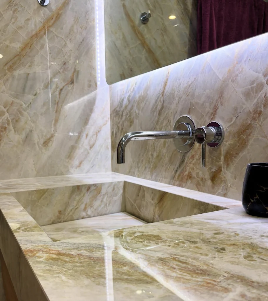 A basin carved from a single slab of Amber Quartzite